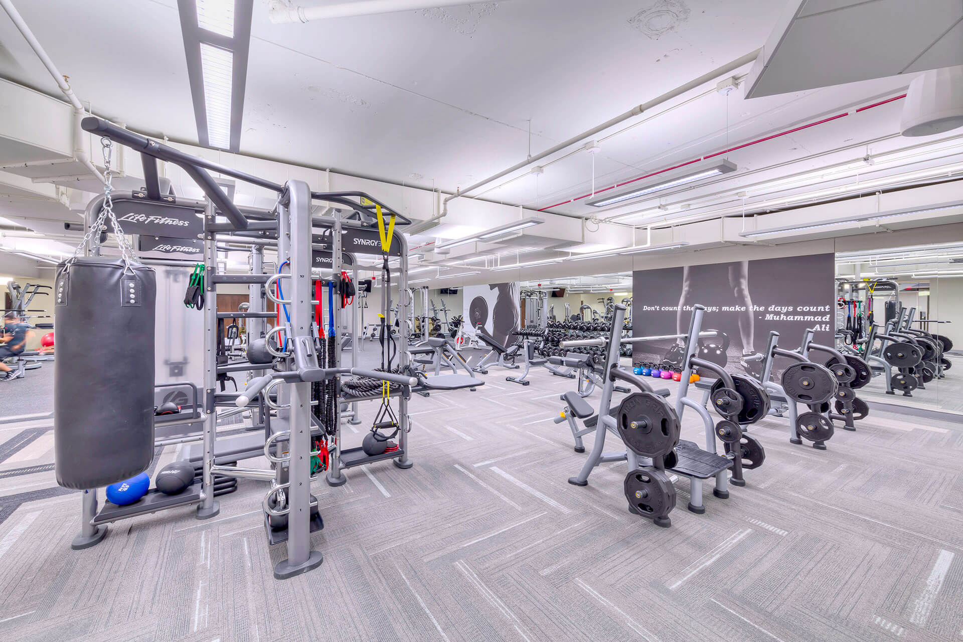 Fitness area with free weights and punching bag at Continental Towers
